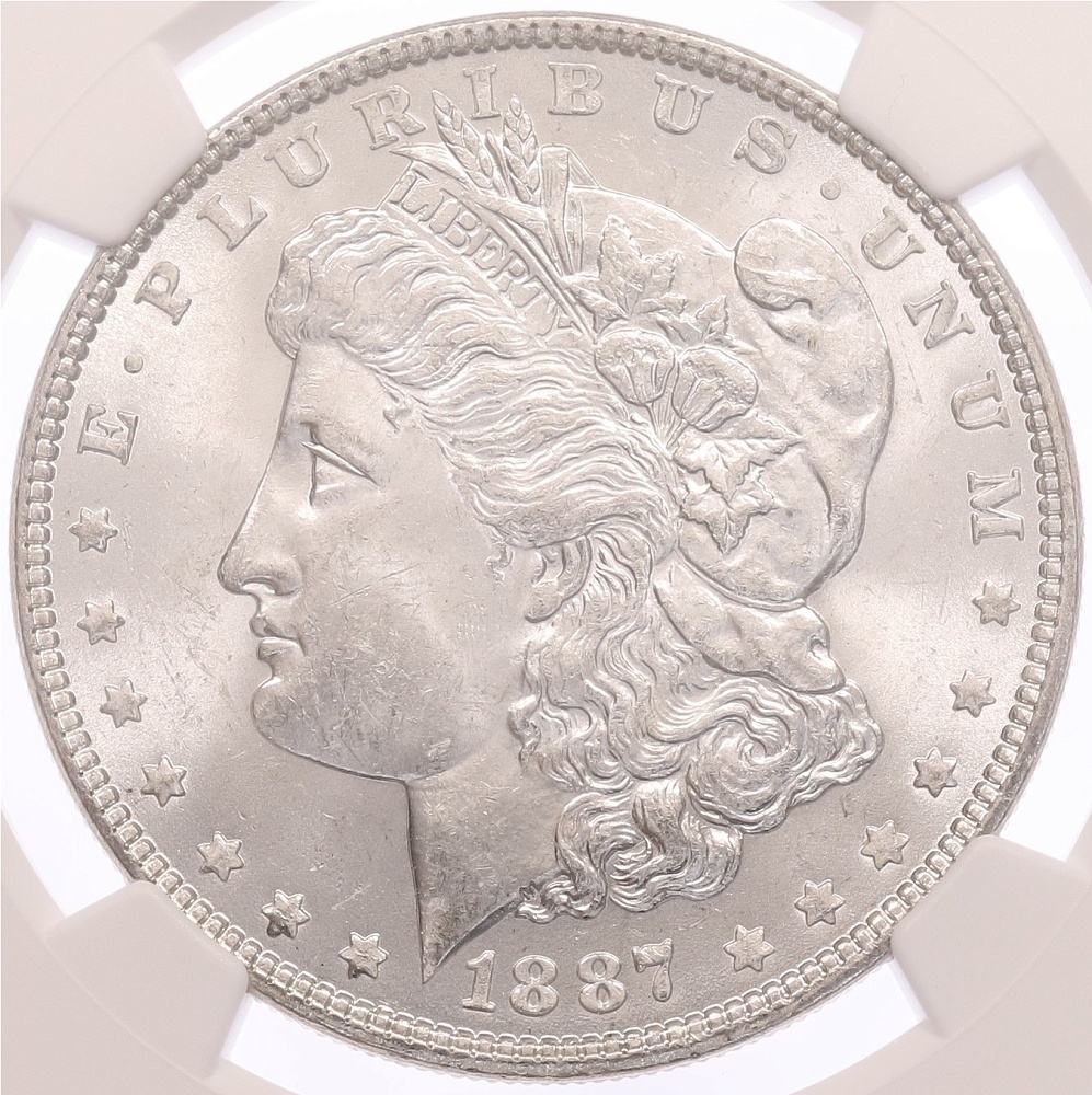 1 доллар 1887 года США «Доллар Моргана» в слабе NGC (MS63) — Фото №1