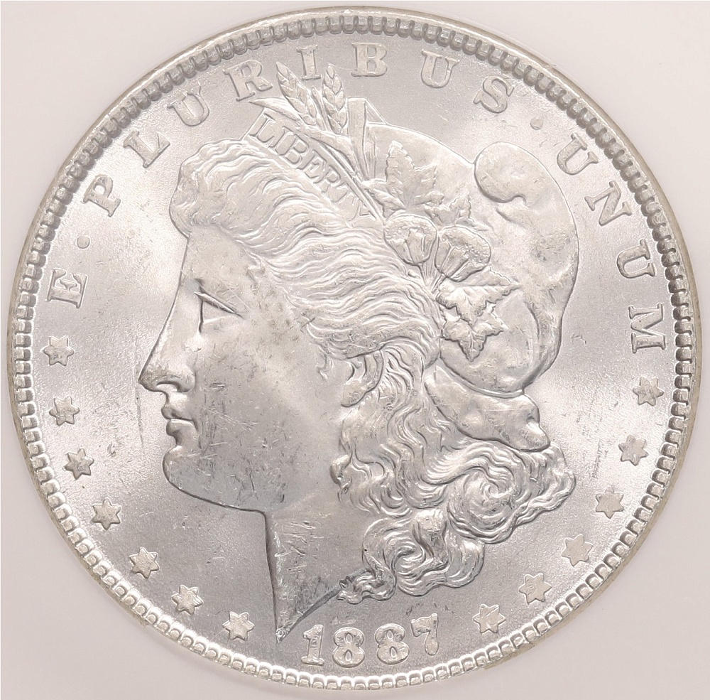 1 доллар 1887 года США «Доллар Моргана» в слабе NGC (MS64) — Фото №1